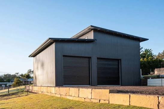 Charcoal skillion shed with two roller doors