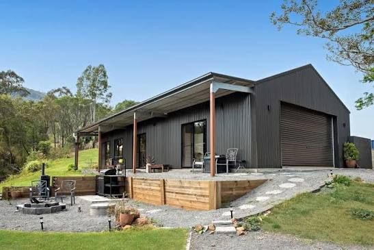 Charcoal steel shed with a verandah and roller door